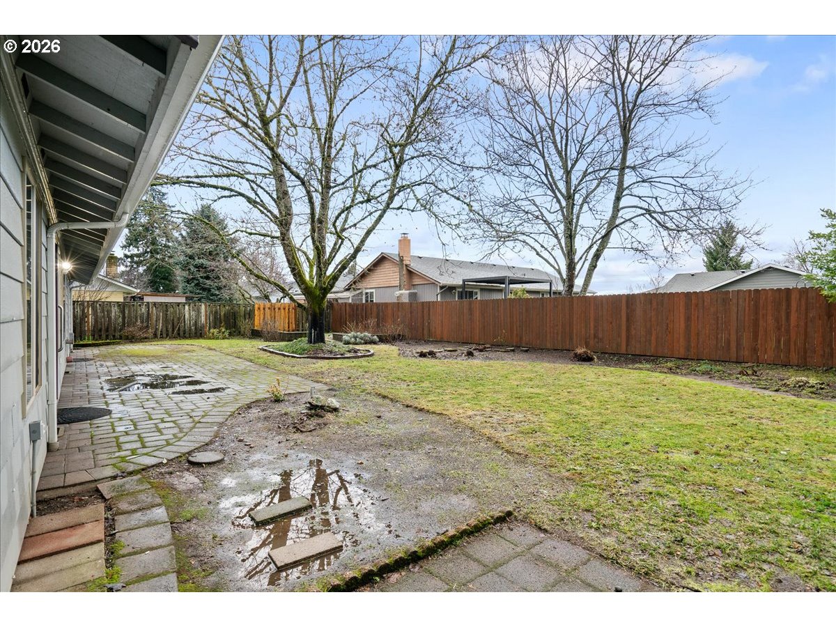 997 Julie Street North Keizer, OR 97303 - Photo 28 of 30 a view of a backyard with wooden fence