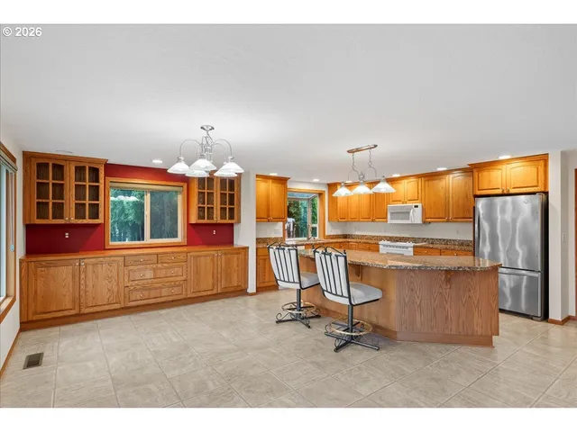 a room with gym equipment and large window