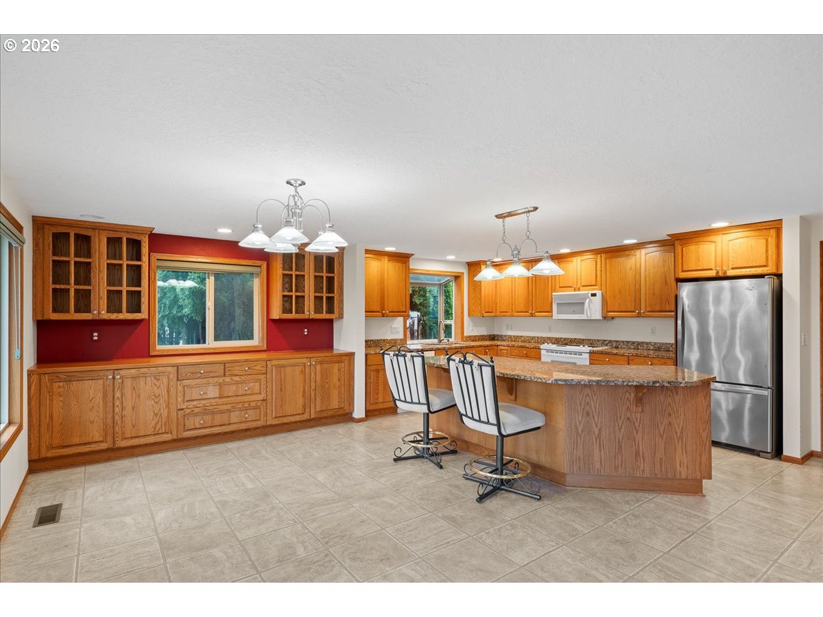 997 Julie Street North Keizer, OR 97303 - Photo 9 of 30 a room with gym equipment and large window