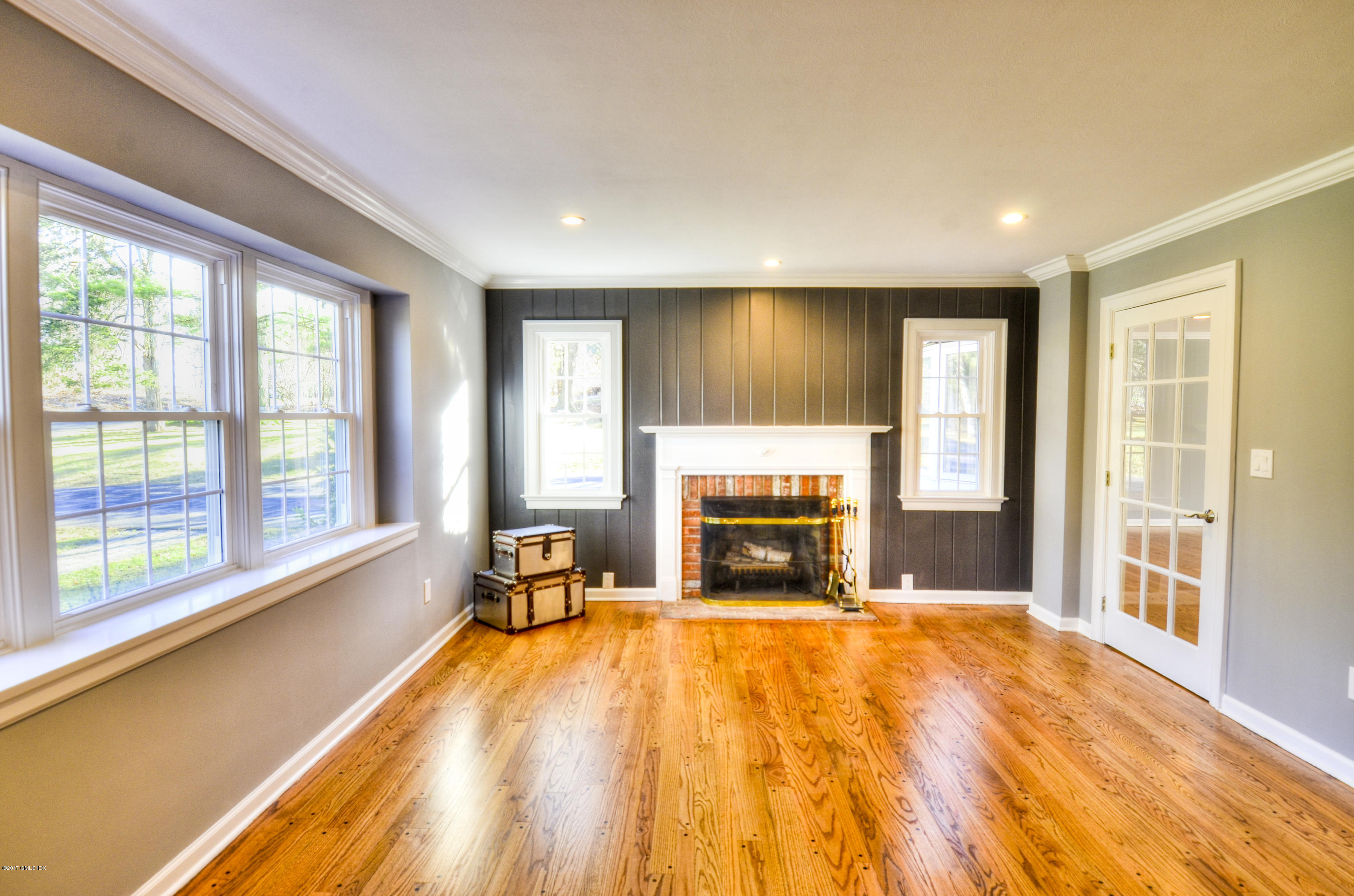 49 Ritch Drive Ridgefield, CT 06877 - Photo 12 of 24 a view of empty room with a fireplace and a large window
