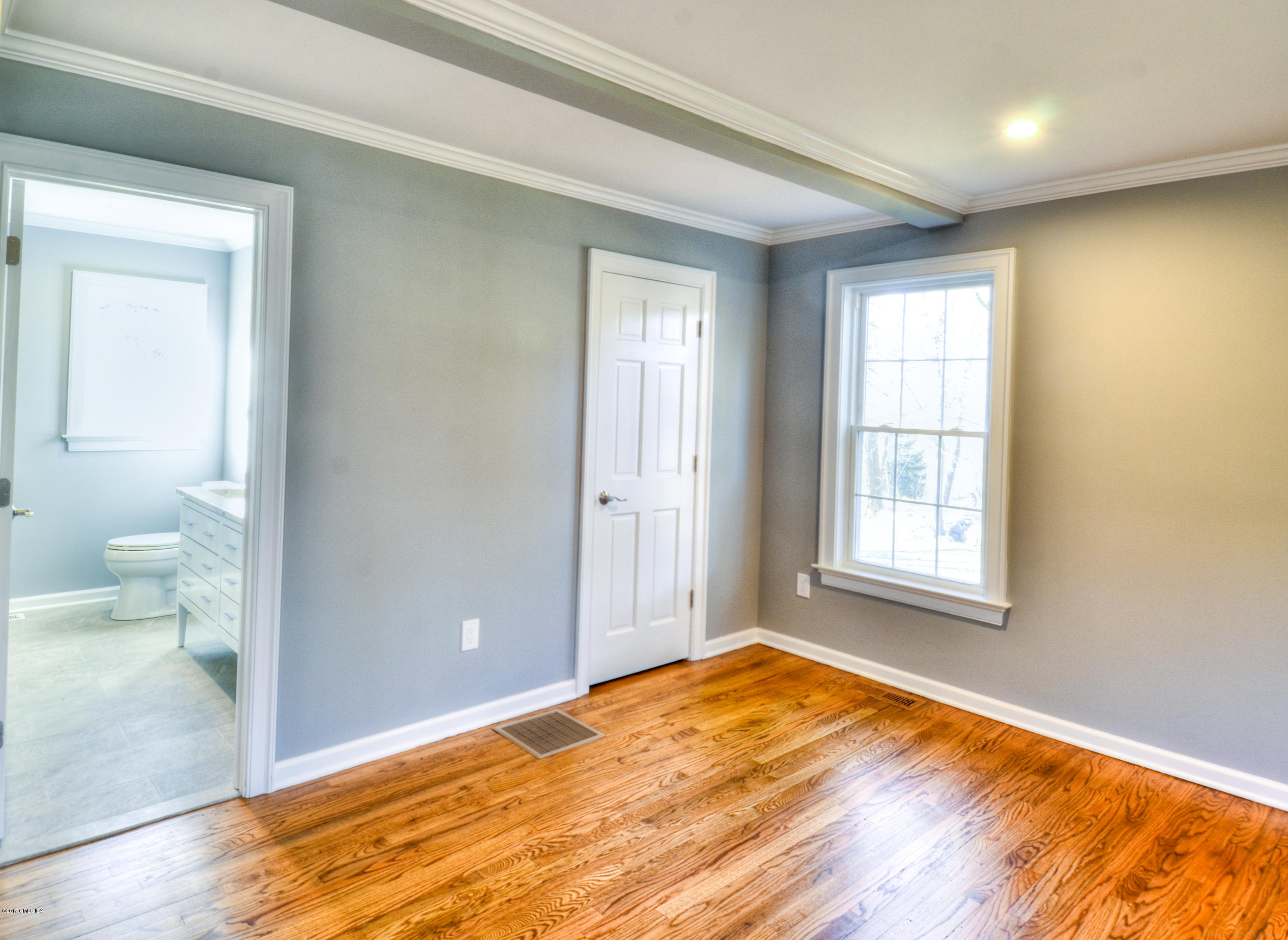 49 Ritch Drive Ridgefield, CT 06877 - Photo 17 of 24 a view of empty room with wooden floor and fan