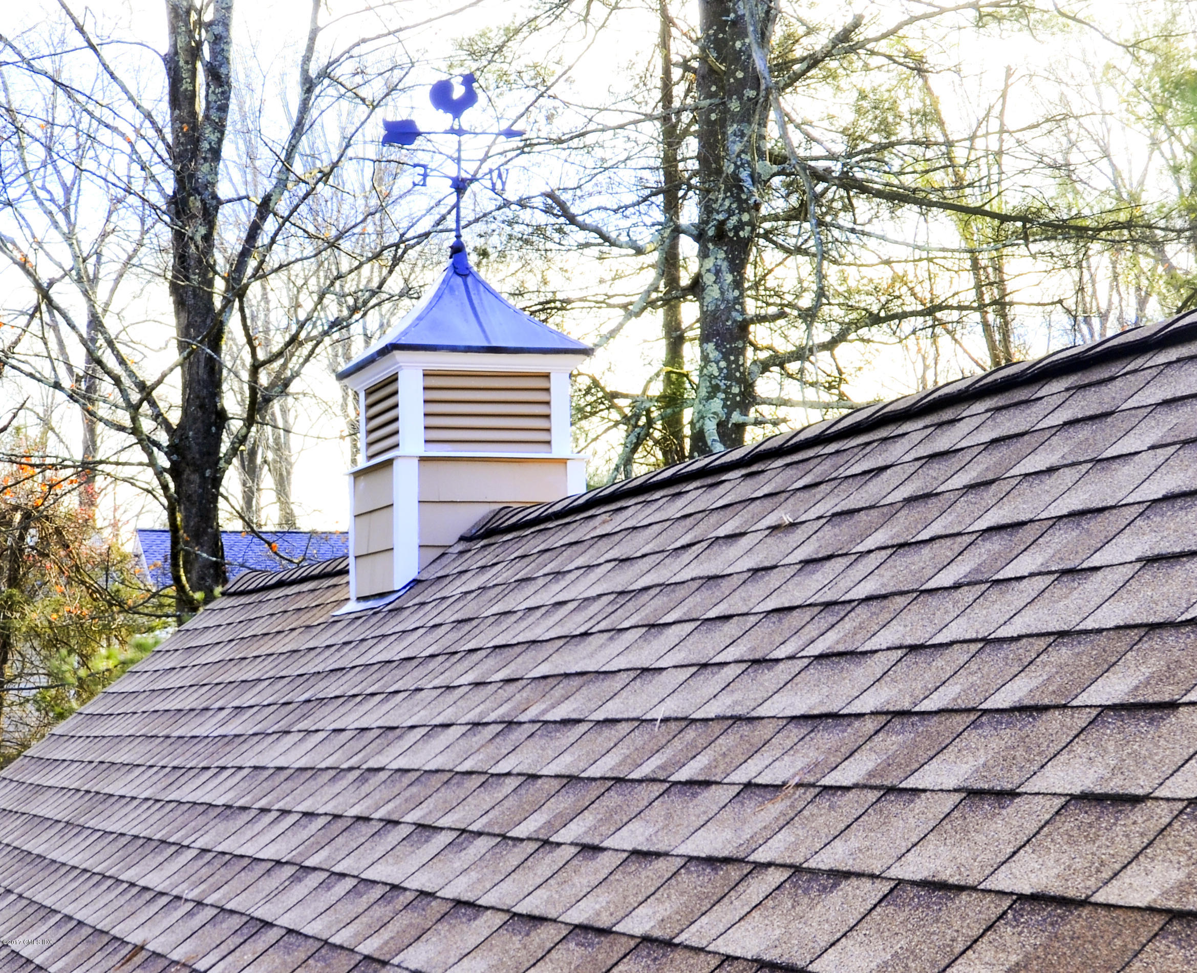 49 Ritch Drive Ridgefield, CT 06877 - Photo 23 of 24 a house view with a bench and trees