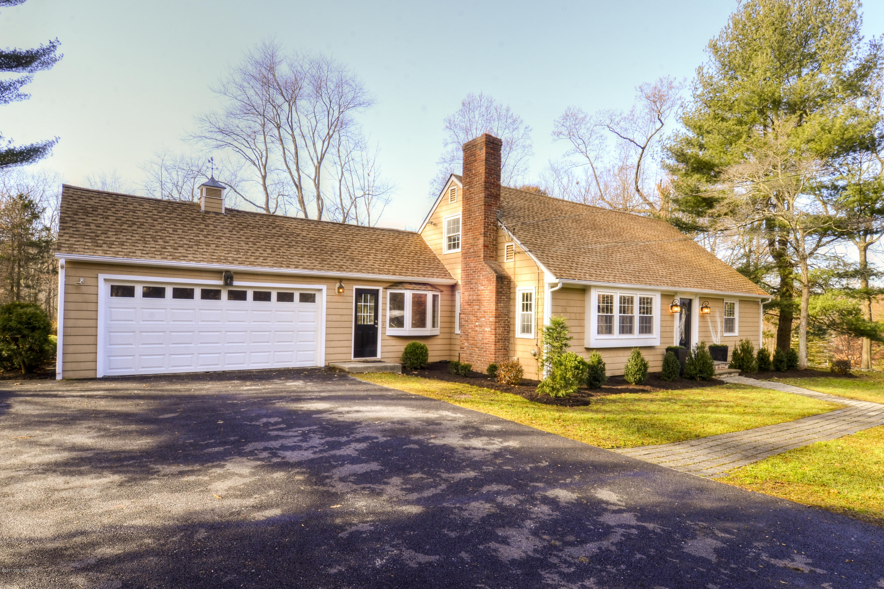49 Ritch Drive Ridgefield, CT 06877 - Photo 24 of 24 a view of a house with a big yard and large trees