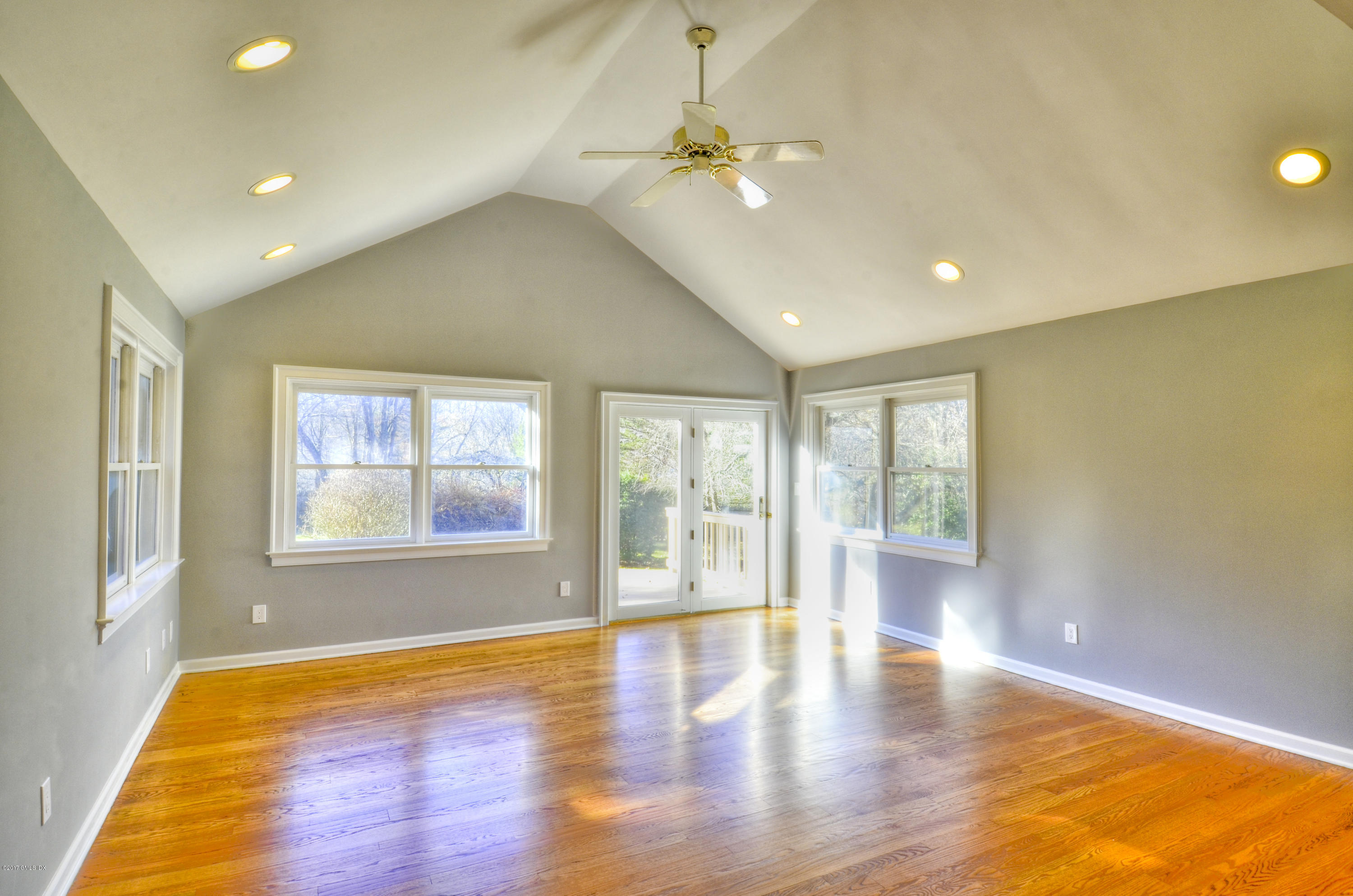 49 Ritch Drive Ridgefield, CT 06877 - Photo 9 of 24 a view of an empty room with wooden floor and a window