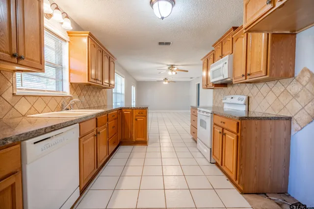 a view of a kitchen with cabinets