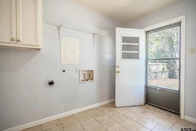 a view of an empty room with a window