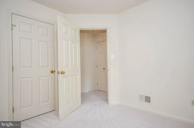 an empty room with a hallway