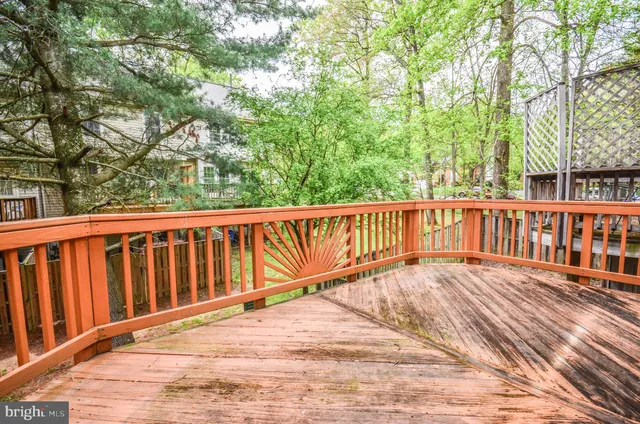 a view of wooden deck and a yard