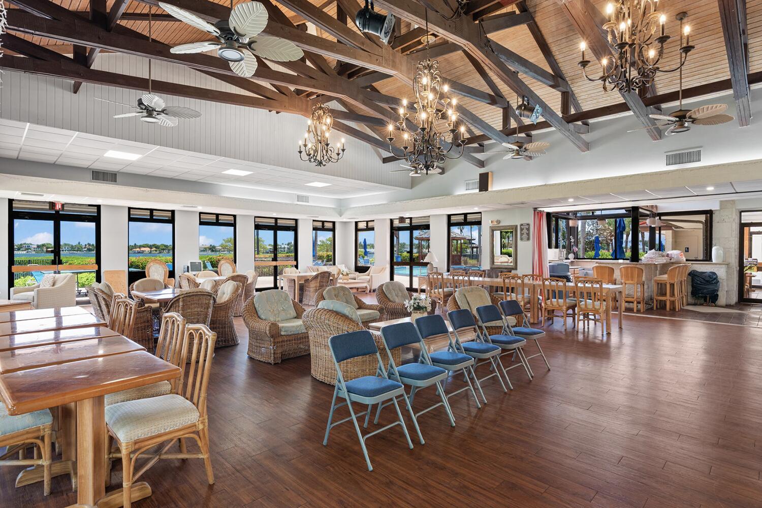 103 Half Moon Circle, Unit D2 Hypoluxo, FL 33462 - Photo 21 of 26 a view of a dining room with furniture window and wooden floor