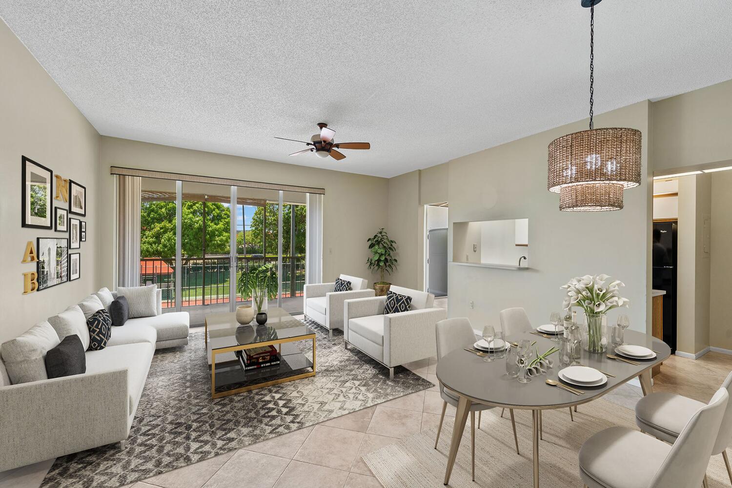 103 Half Moon Circle, Unit D2 Hypoluxo, FL 33462 - Photo 5 of 26 a living room with furniture and a table