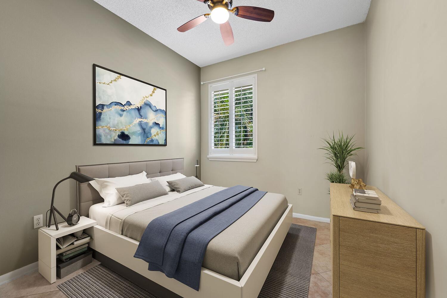 103 Half Moon Circle, Unit D2 Hypoluxo, FL 33462 - Photo 9 of 26 a bedroom with bed and a chandelier