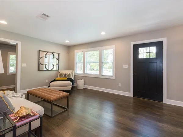 a living room with furniture and a window