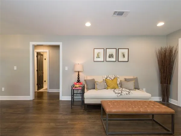 a bedroom with a bed and a night stand