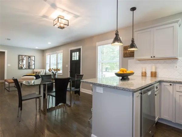 a kitchen with sink cabinets and window