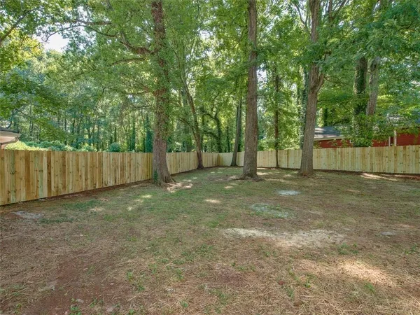a view of backyard with green space