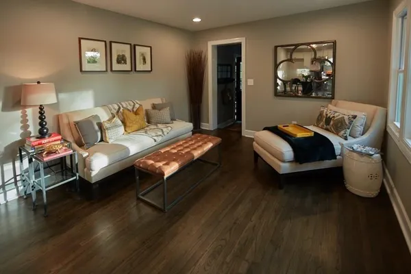 a living room with furniture and wooden floor