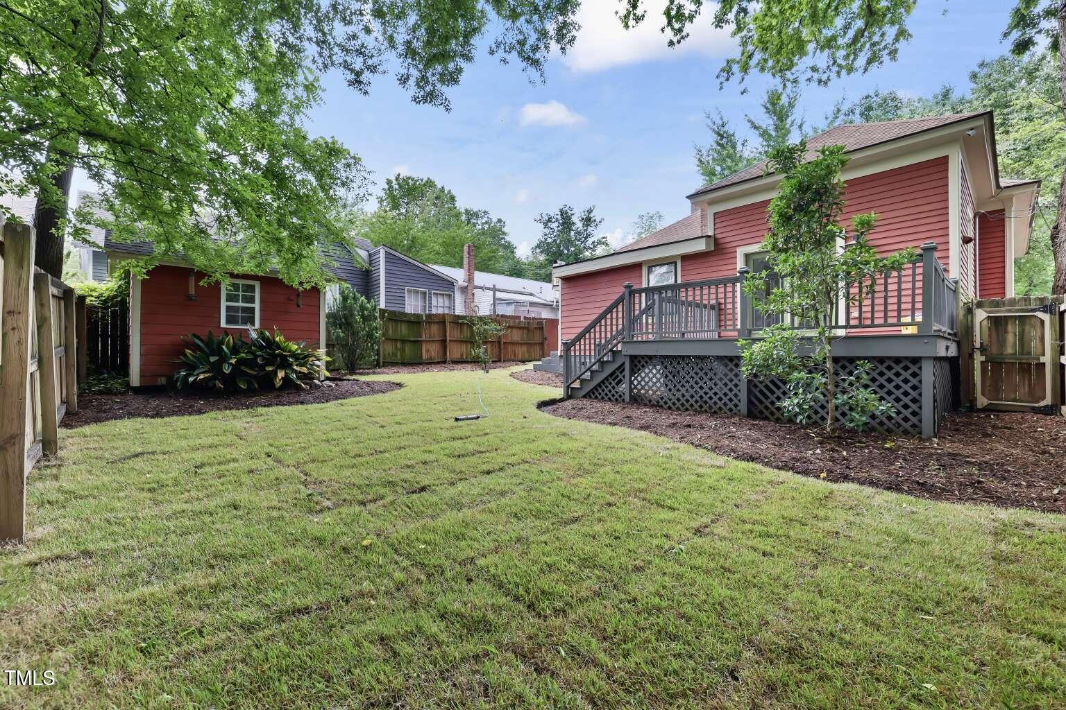 304 Linden Avenue Raleigh, NC 27601 - Photo 12 of 33 a view of a house with backyard and sitting area