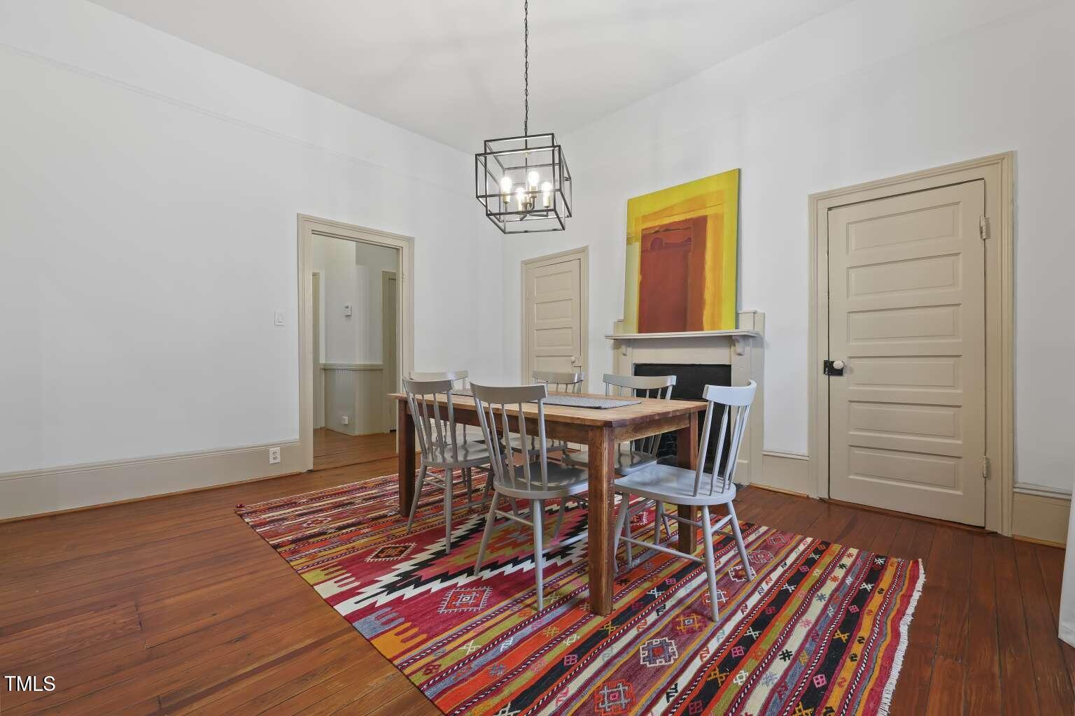 304 Linden Avenue Raleigh, NC 27601 - Photo 18 of 33 a view of a dining room with furniture and wooden floor