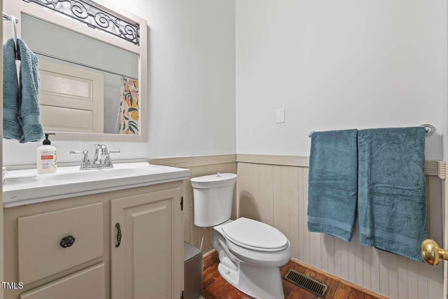 304 Linden Avenue Raleigh, NC 27601 - Photo 21 of 33 a bathroom with a sink a toilet and shower