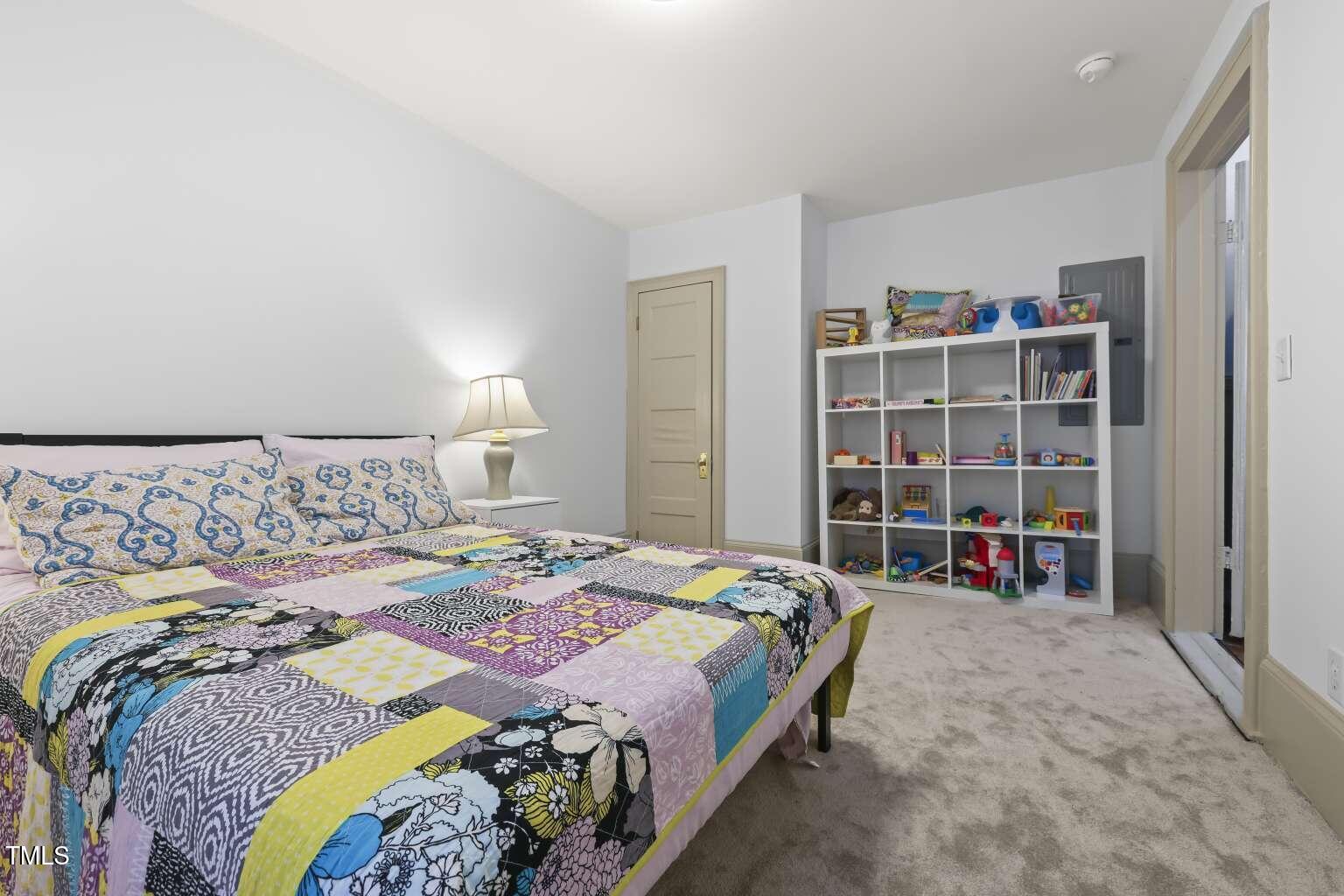 304 Linden Avenue Raleigh, NC 27601 - Photo 28 of 33 a bedroom with a bed and a large window