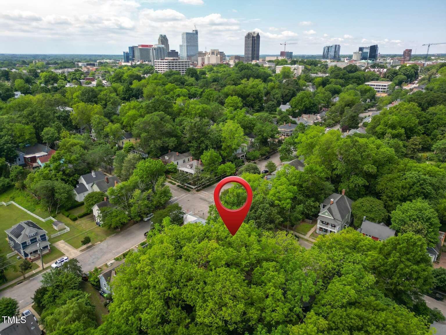 304 Linden Avenue Raleigh, NC 27601 - Photo 31 of 33 an aerial view of a house with a yard and lake view