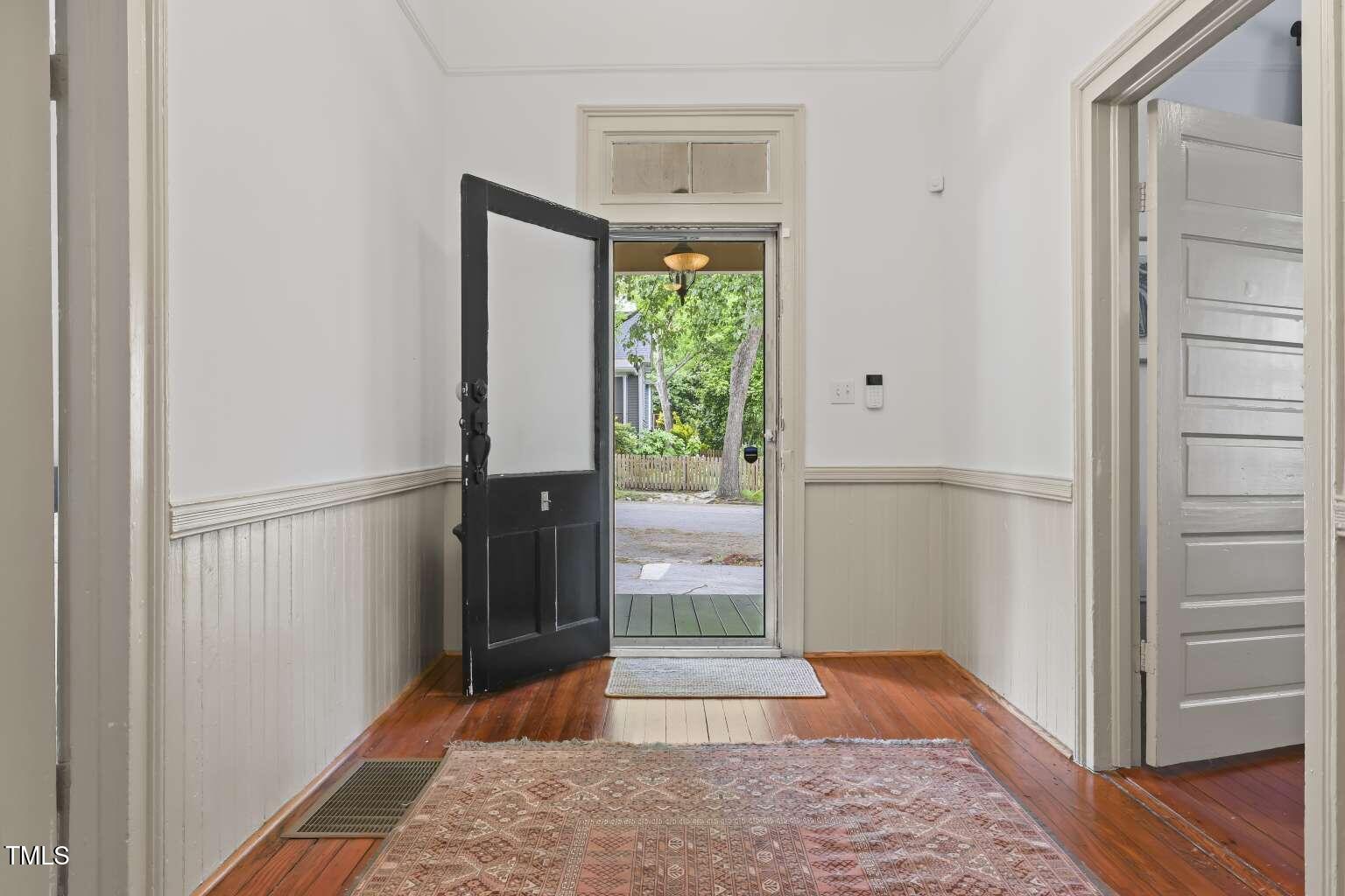 304 Linden Avenue Raleigh, NC 27601 - Photo 4 of 33 a view of entryway with wooden floor