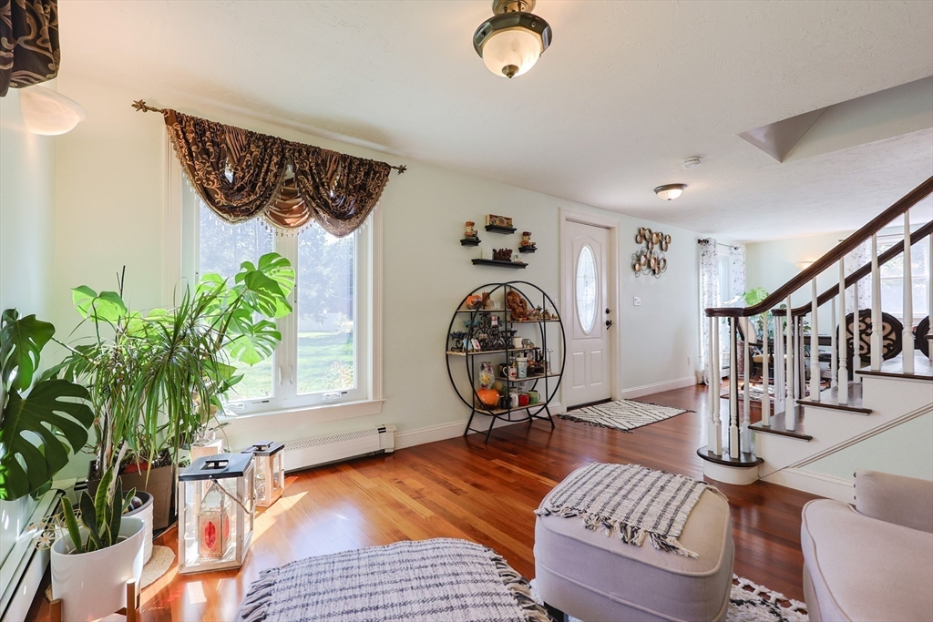 2 Rhodes Avenue Sharon, MA 02067 - Photo 11 of 42 a view of a livingroom with furniture a dinning table and chair