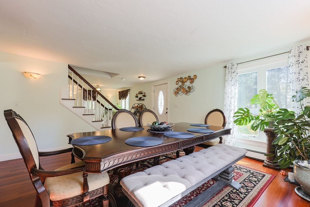 2 Rhodes Avenue Sharon, MA 02067 - Photo 13 of 42 a table and chairs in a room
