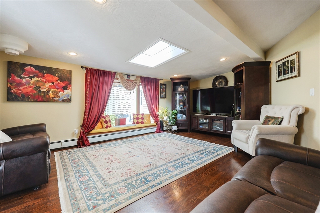 2 Rhodes Avenue Sharon, MA 02067 - Photo 16 of 42 a living room with furniture and a flat screen tv