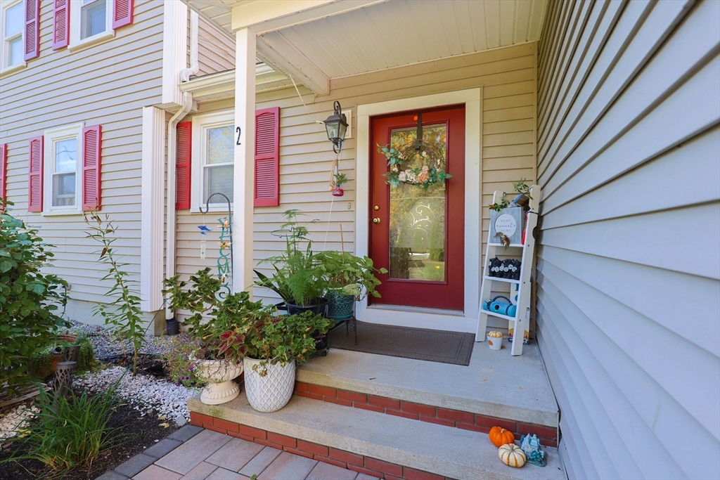 2 Rhodes Avenue Sharon, MA 02067 - Photo 2 of 42 a potted plant sitting in front of a house