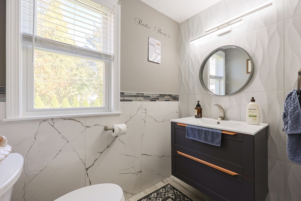 2 Rhodes Avenue Sharon, MA 02067 - Photo 21 of 42 a bathroom with a toilet a sink and a mirror