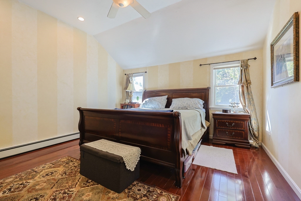 2 Rhodes Avenue Sharon, MA 02067 - Photo 24 of 42 a bedroom with a bed and wooden floor