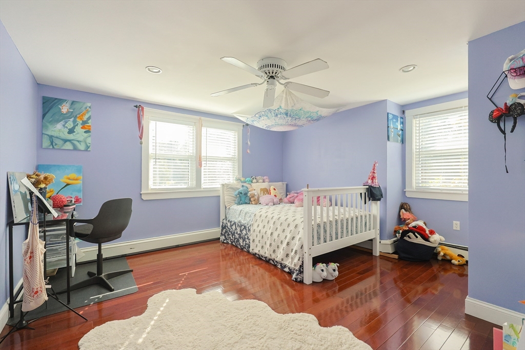 2 Rhodes Avenue Sharon, MA 02067 - Photo 29 of 42 a bedroom with a bed and wooden floor