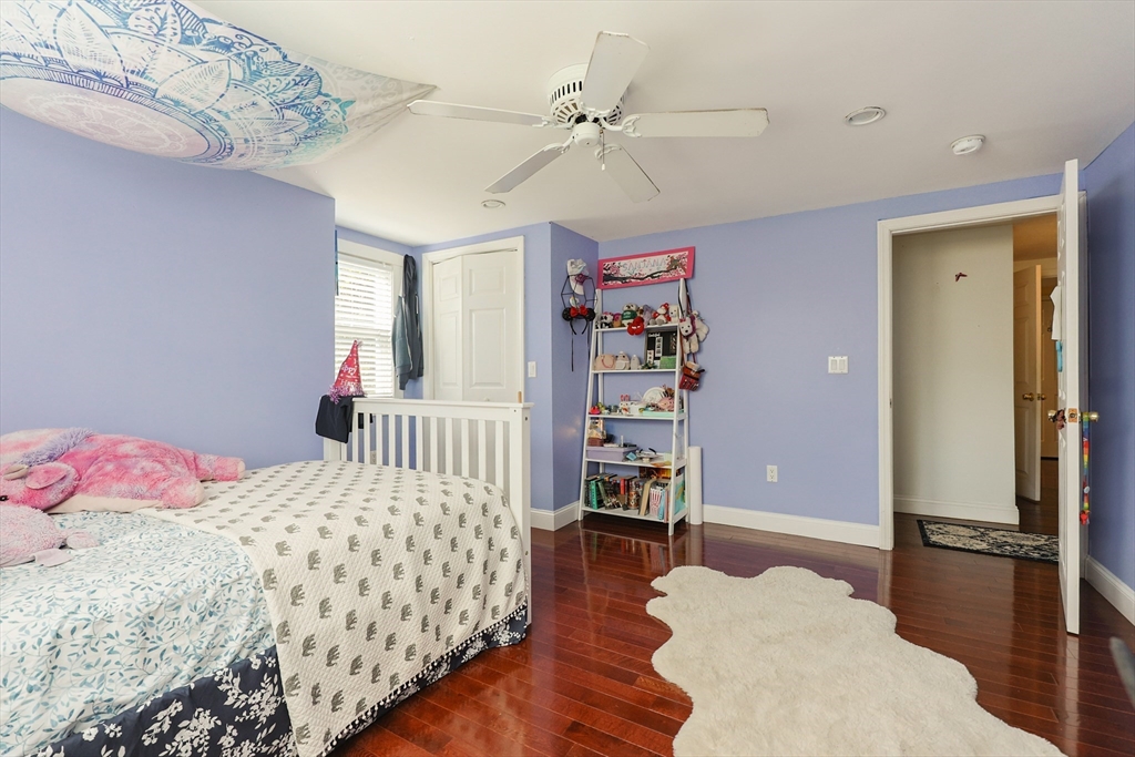 2 Rhodes Avenue Sharon, MA 02067 - Photo 30 of 42 a bedroom with a bed and a walk in closet