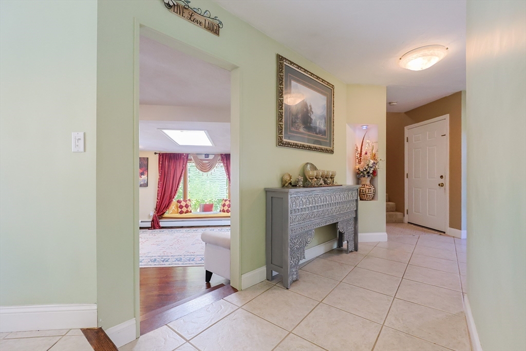 2 Rhodes Avenue Sharon, MA 02067 - Photo 3 of 42 a view of an entryway with fireplace