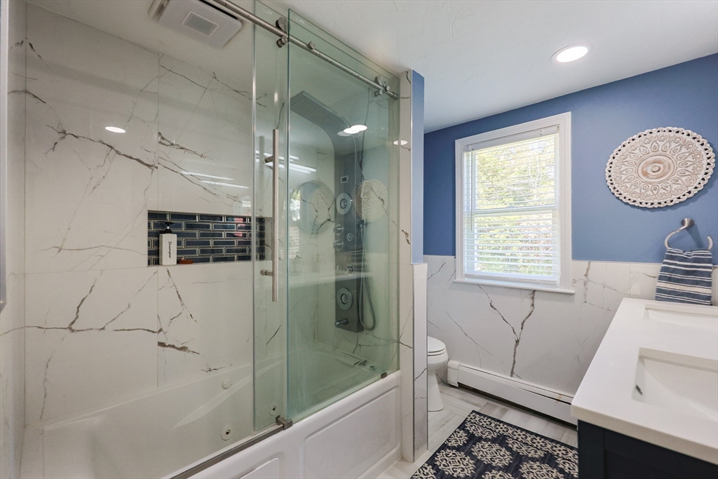 2 Rhodes Avenue Sharon, MA 02067 - Photo 32 of 42 a bathroom with a bathtub and a shower