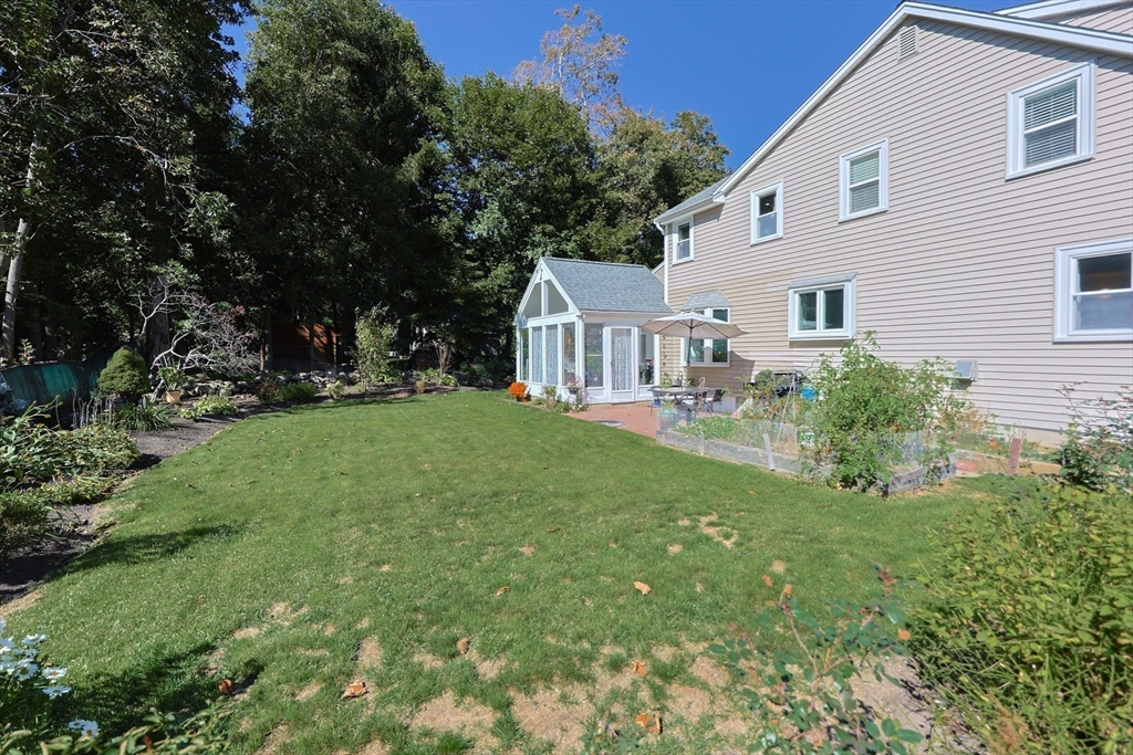 2 Rhodes Avenue Sharon, MA 02067 - Photo 37 of 42 a view of house with backyard and a garden