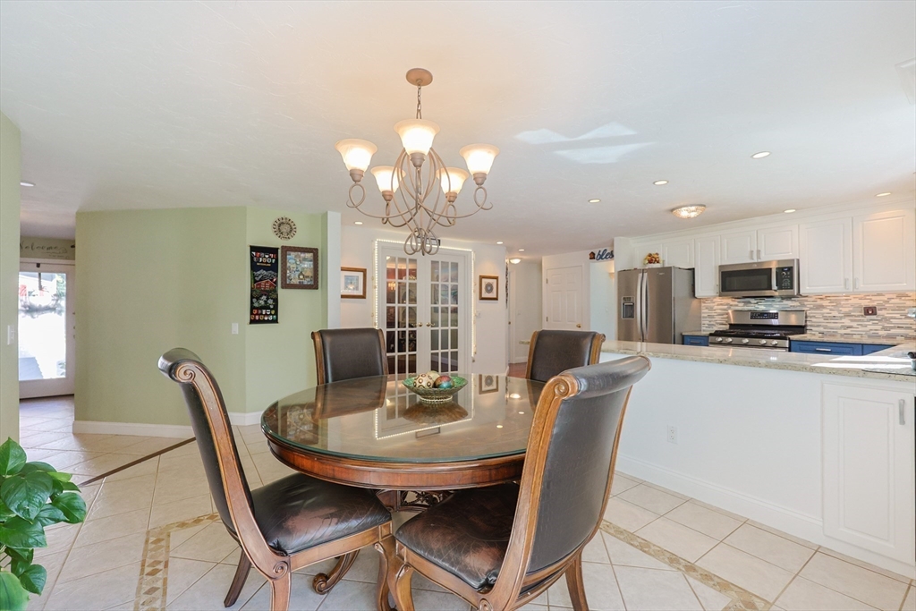 2 Rhodes Avenue Sharon, MA 02067 - Photo 4 of 42 a view of a dining room with furniture and wooden floor