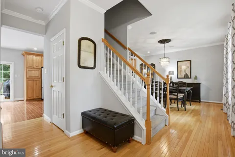 a living room with furniture and wooden floors