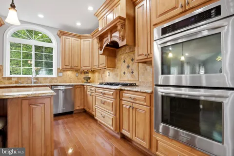 a kitchen with a sink stove and microwave