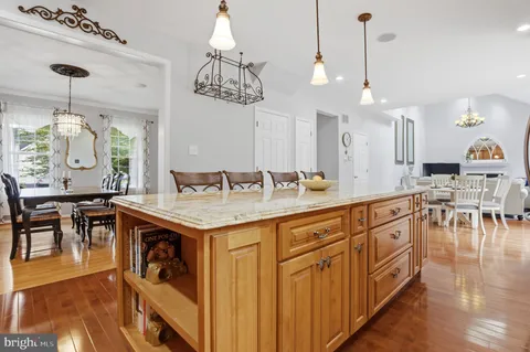 a kitchen with wooden cabinets and center island