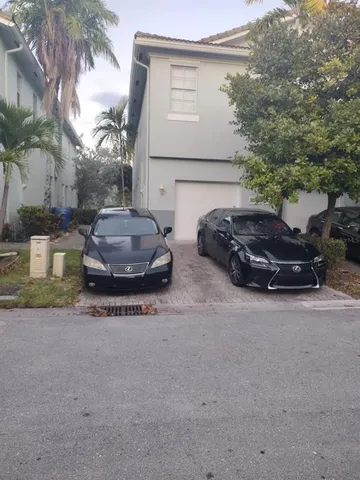 a car parked in front of a house