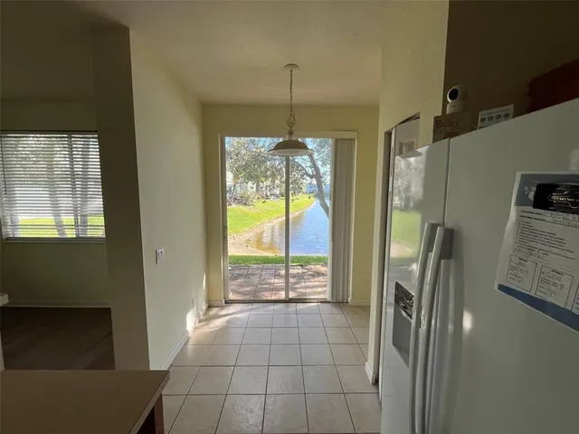 a bathroom with a glass door shower and a yard