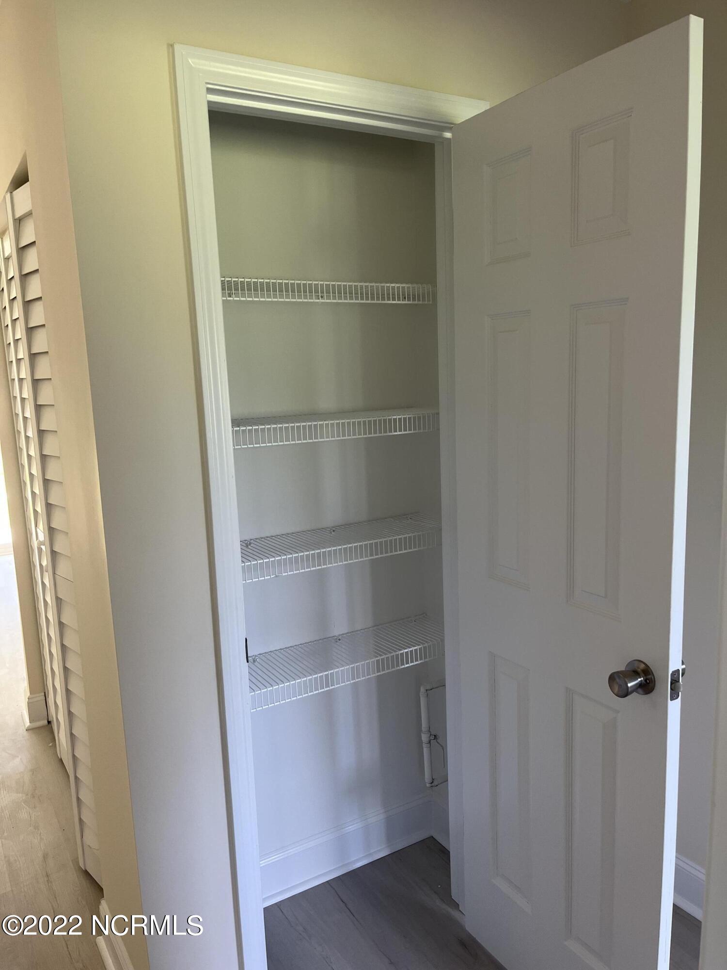 2036 Sloop Point Loop Road, Unit A5 Hampstead, NC 28443 - Photo 3 of 6 Linen Closet
