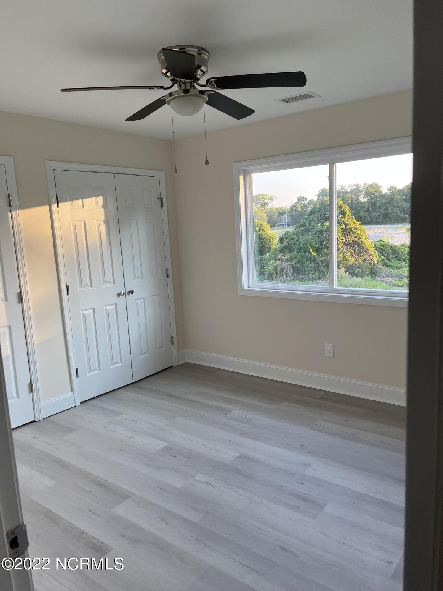 2036 Sloop Point Loop Road, Unit A5 Hampstead, NC 28443 - Photo 5 of 6 Master Bedroom
