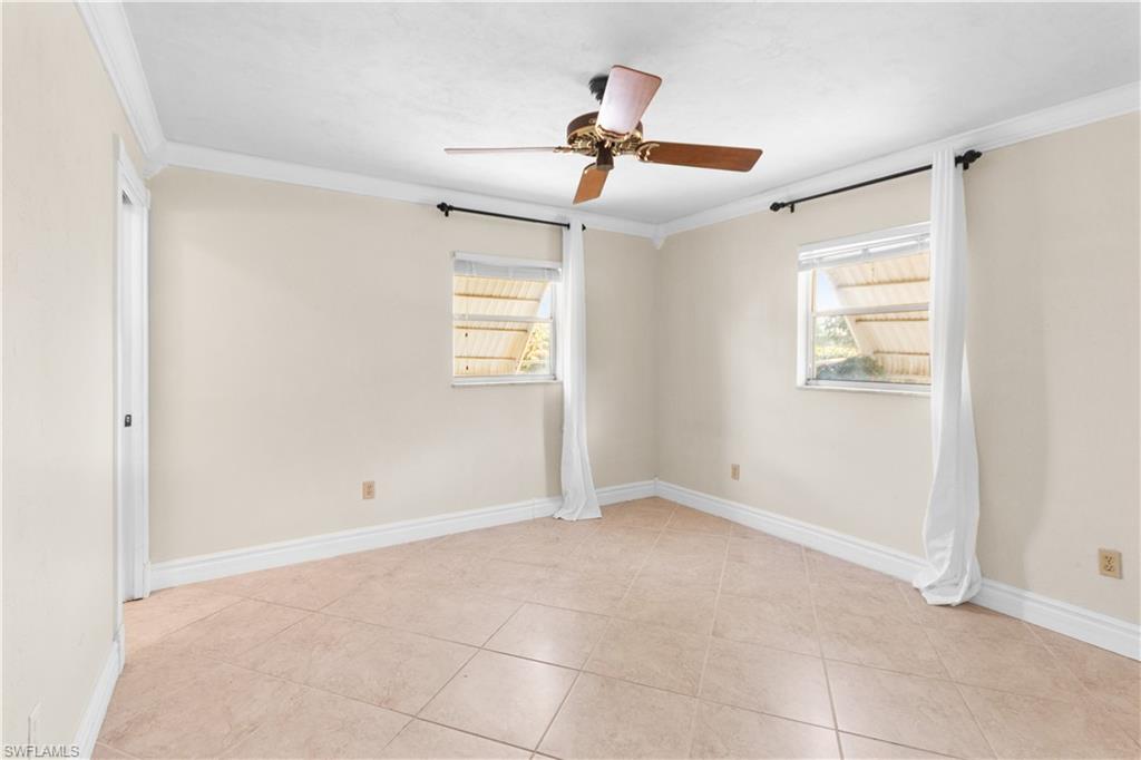 7225 Jasmine Road Fort Myers, FL 33967 - Photo 14 of 24 a view of an empty room with a window