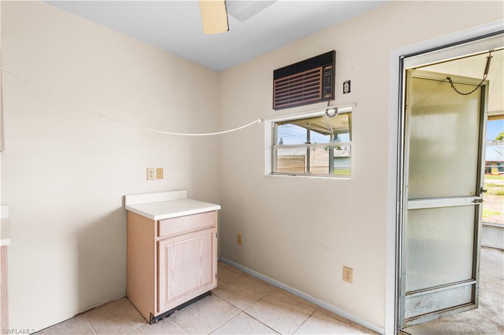 7225 Jasmine Road Fort Myers, FL 33967 - Photo 20 of 24 a utility room with cabinets washer and dryer