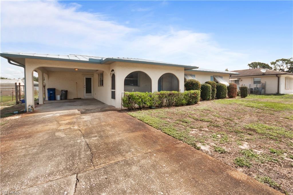 7225 Jasmine Road Fort Myers, FL 33967 - Photo 2 of 24 a view of a house with a outdoor space