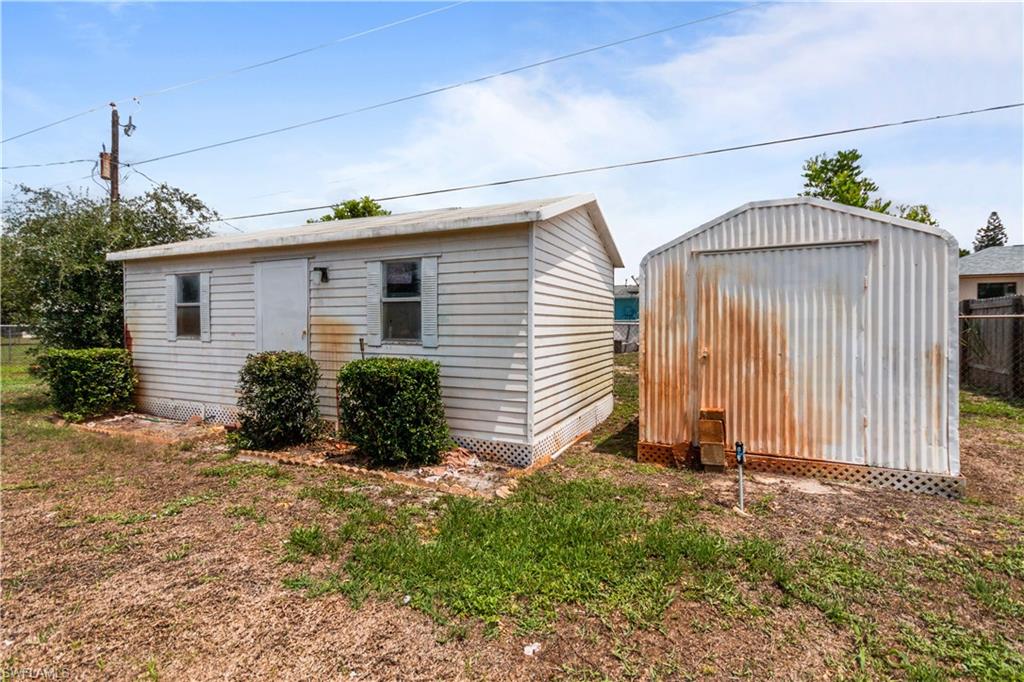 7225 Jasmine Road Fort Myers, FL 33967 - Photo 23 of 24 a view of a house with backyard and garden