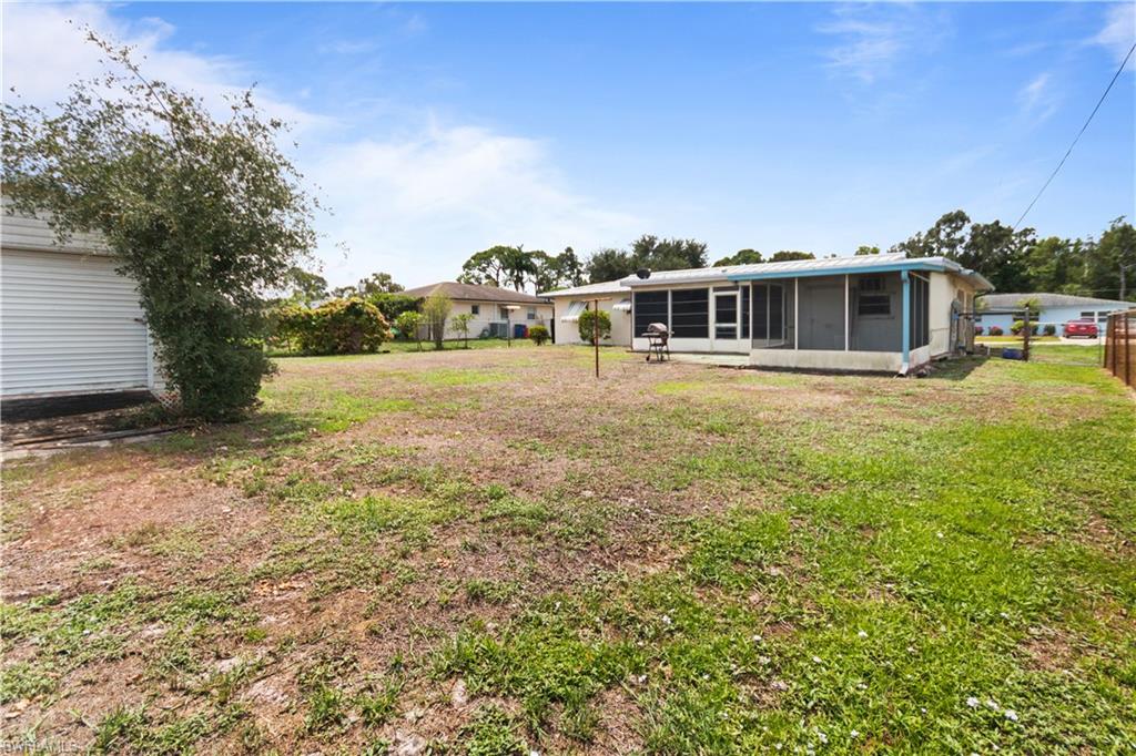 7225 Jasmine Road Fort Myers, FL 33967 - Photo 24 of 24 a view of a house with yard and sitting area